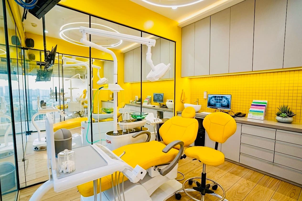 Modern yellow dental treatment suite at Bhai-Bhai Dental Clinic